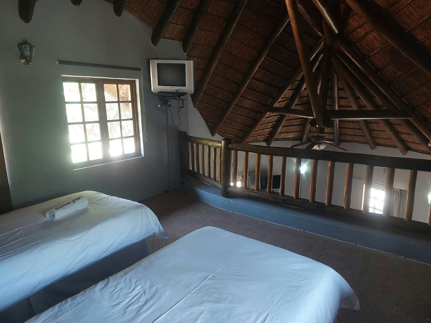 Family Unit — loft beds under thatch